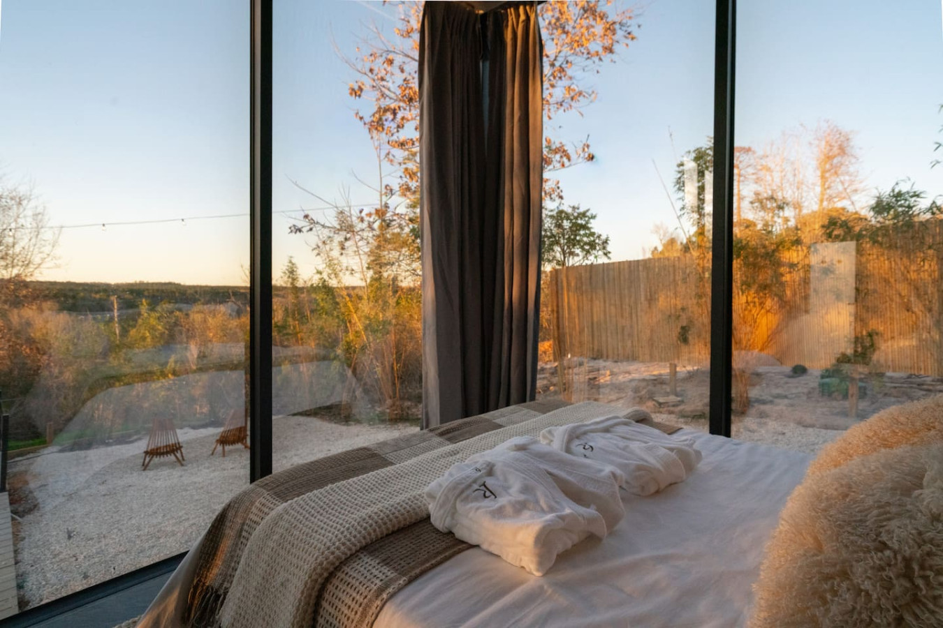Interior of Mirror House — bedroom with floor-to-ceiling windows